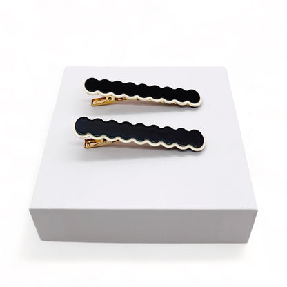 Dabble Doll black hair clips with gold accents, perfect for girls and women who love stylish accessories