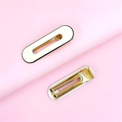 Gold Dabble Doll Hair Clips for girls and women with a sleek design on a pink background