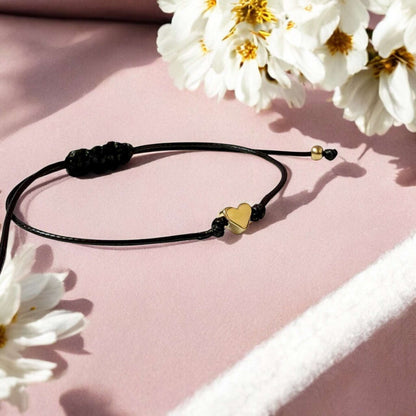 Dabble Doll Heart bracelet in black cord with a gold heart charm for girls and women