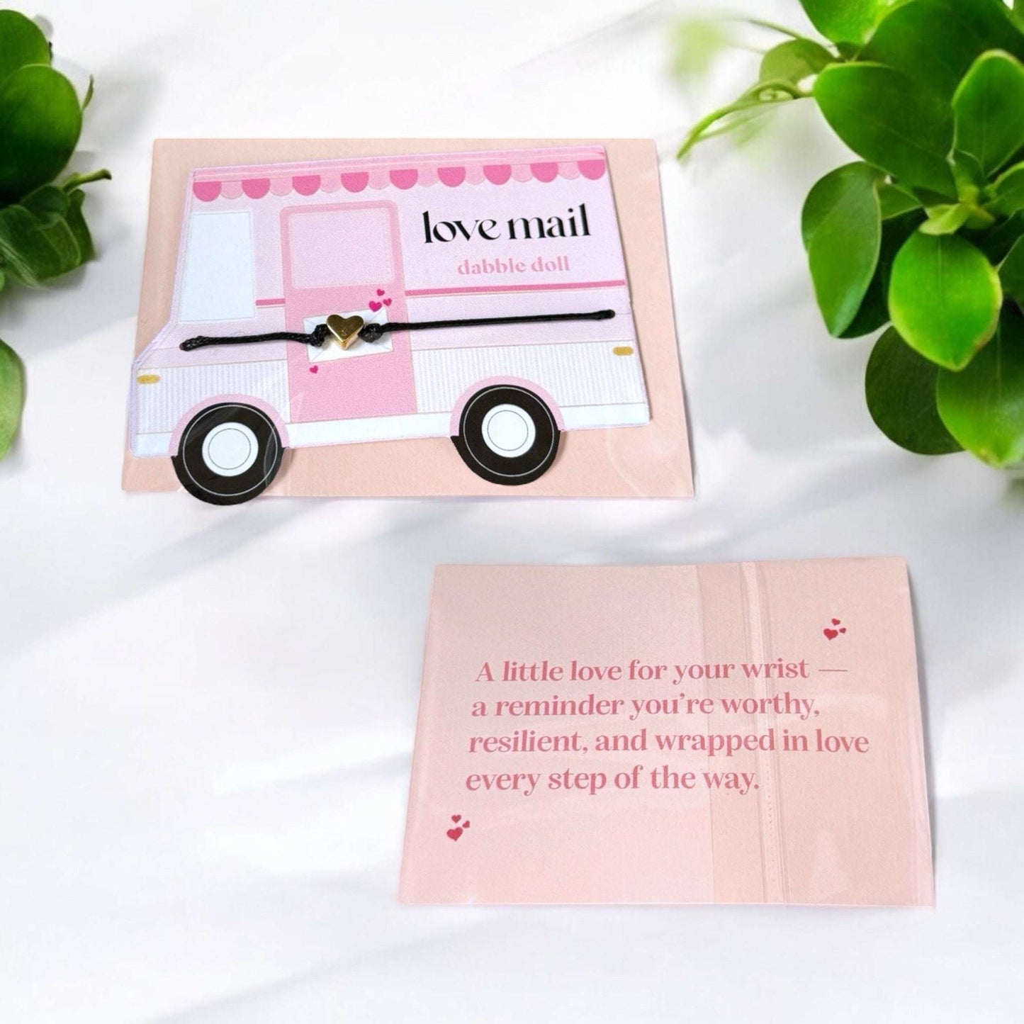 Dabble Doll heart bracelet in gold with a delicate design for girls and women, presented on a love-themed card