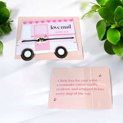Dabble Doll heart bracelet in gold with a delicate design for girls and women, presented on a love-themed card