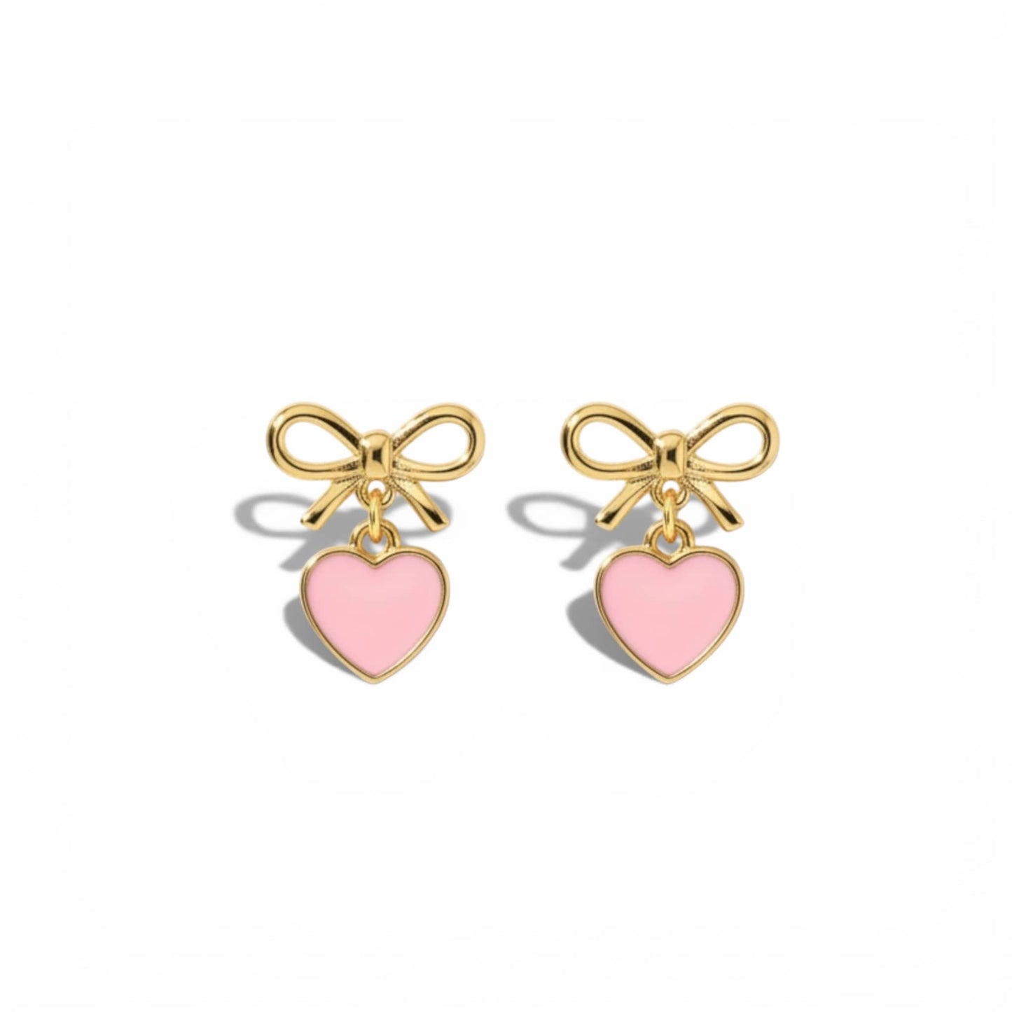Gold Dabble Doll heart earrings with pink enamel hearts and delicate bow details