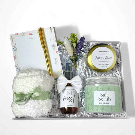 Dabble Doll luxury relaxation gift box with salt scrub, jasmine flower candle, linen mist, cozy towel, and floral notepad