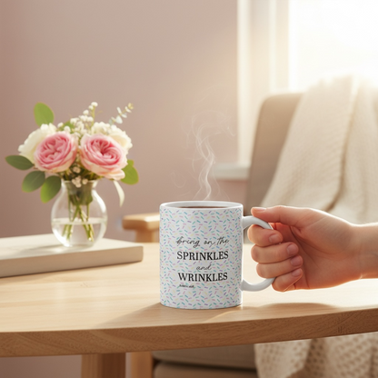 Dabble Doll mug with the phrase Bring on the sprinkles and wrinkles, with colorful sprinkles design