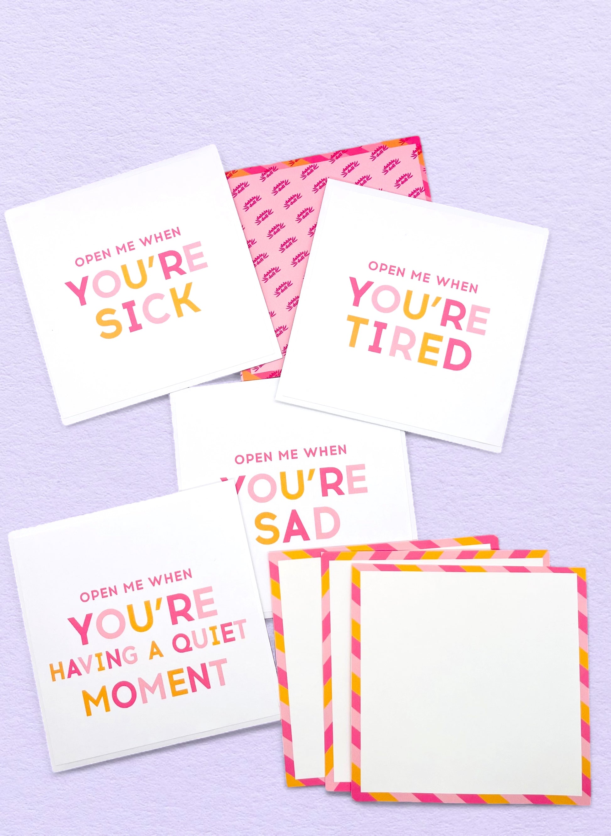Dabble Doll Open Me When set of colorful cards for girls and women, featuring encouraging messages in pink and orange.
