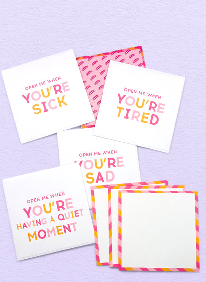 Dabble Doll Open Me When set of colorful cards for girls and women, featuring encouraging messages in pink and orange.