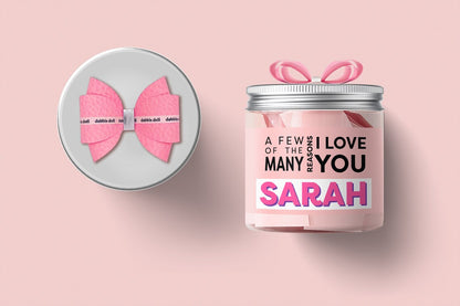 Personalized gift set for girls featuring a pink bow and candle labeled with 'Sarah' for women and ladies