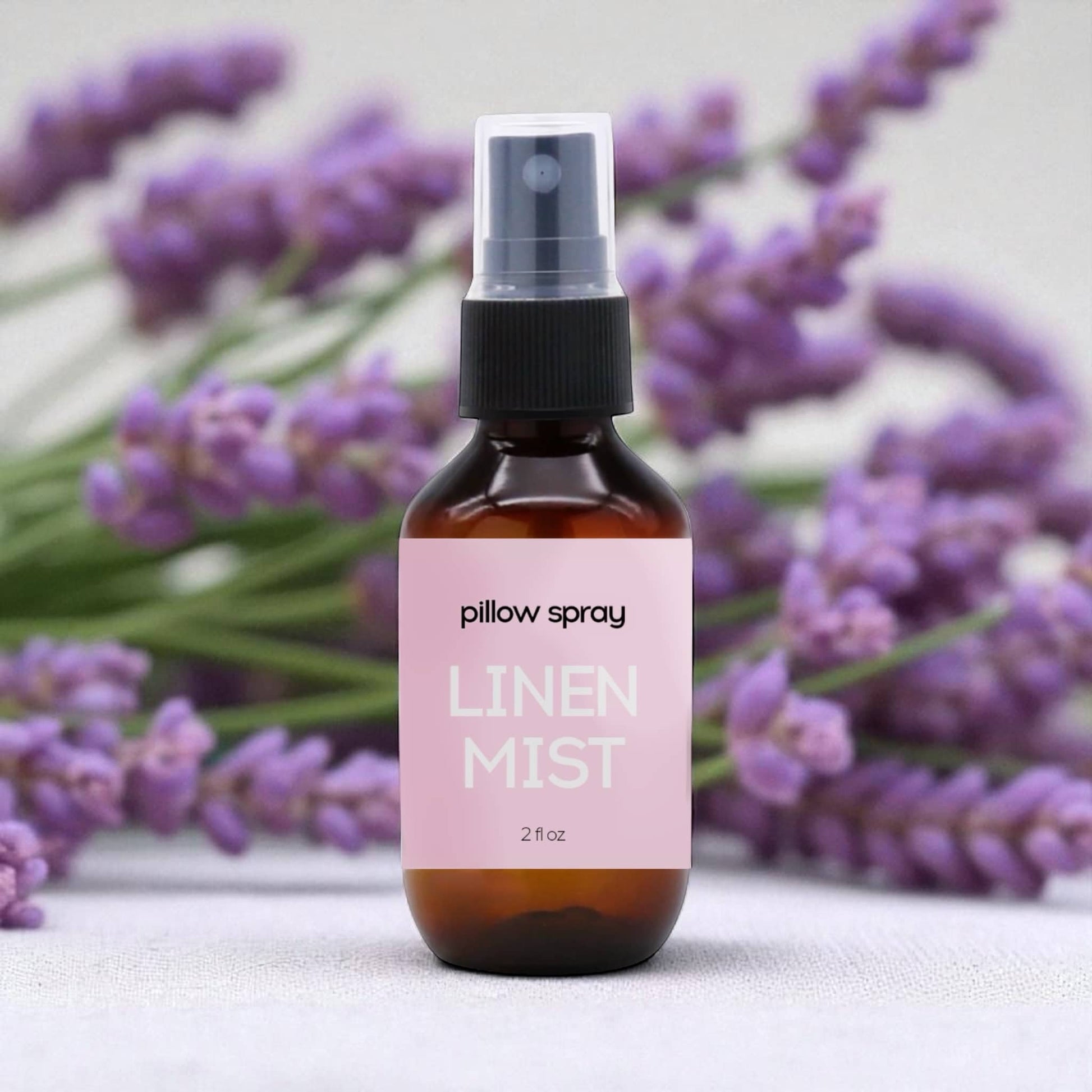 Dabble Doll Linen Mist Pillow Spray in amber bottle with floral lavender background for women and girls