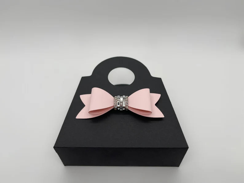Dabble Doll black purse bag with a pink bow, perfect for girls and women, made from stylish material