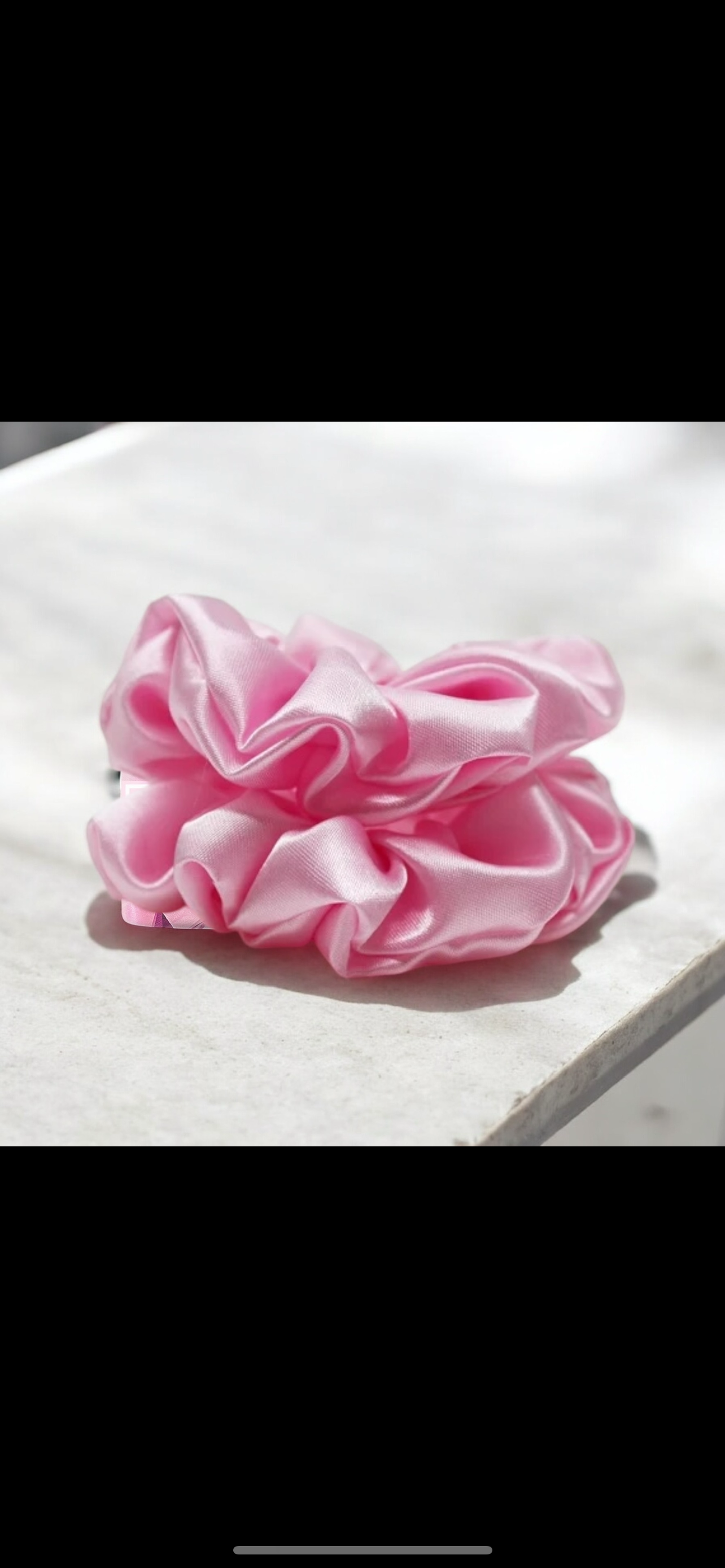 Pink satin scrunchie by Dabble Doll, perfect for girls and women, adding a stylish touch to any hairstyle
