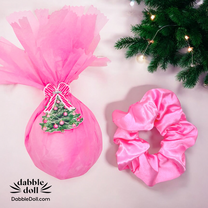 Pink satin scrunchie for girls and women, perfect for adding style to any hairstyle