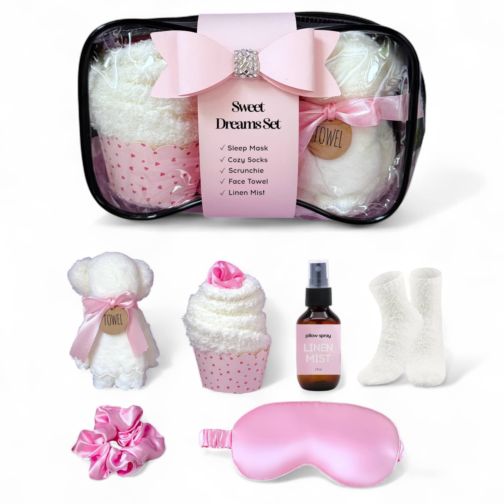 Dabble Doll sleep gift set for girls featuring pink items including a sleep mask, cozy socks, and a scrunchie