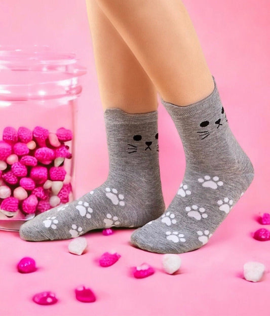 Cute Dabble Doll Socks with Cat Face Design and Paw Print Patterns on Gray Background