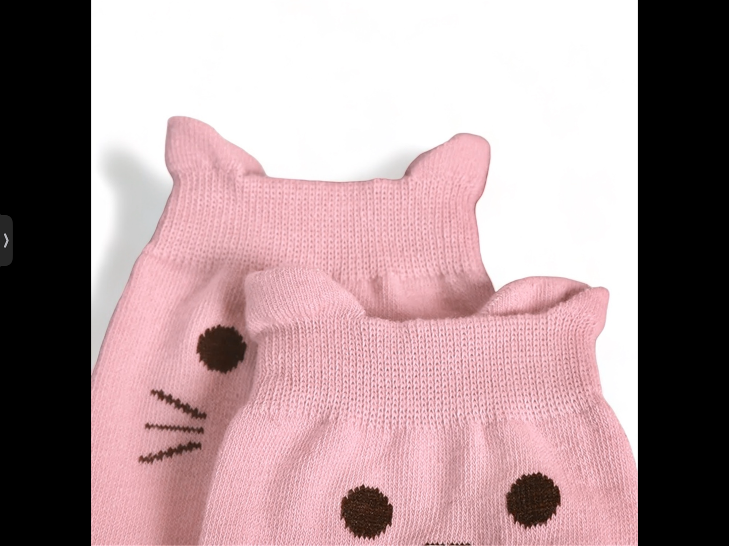 Cute pink Dabble Doll socks with cat ears and facial design for playful comfort