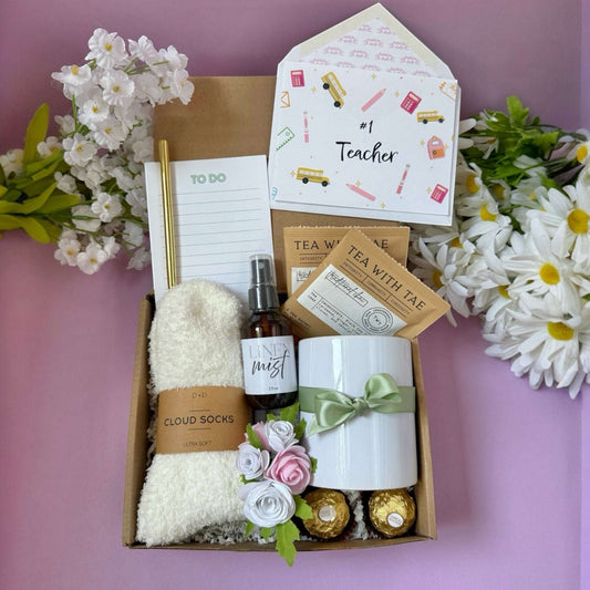 Dabble Doll teacher appreciation gift set with cozy cloud socks white mug green bow tea packets and notepad