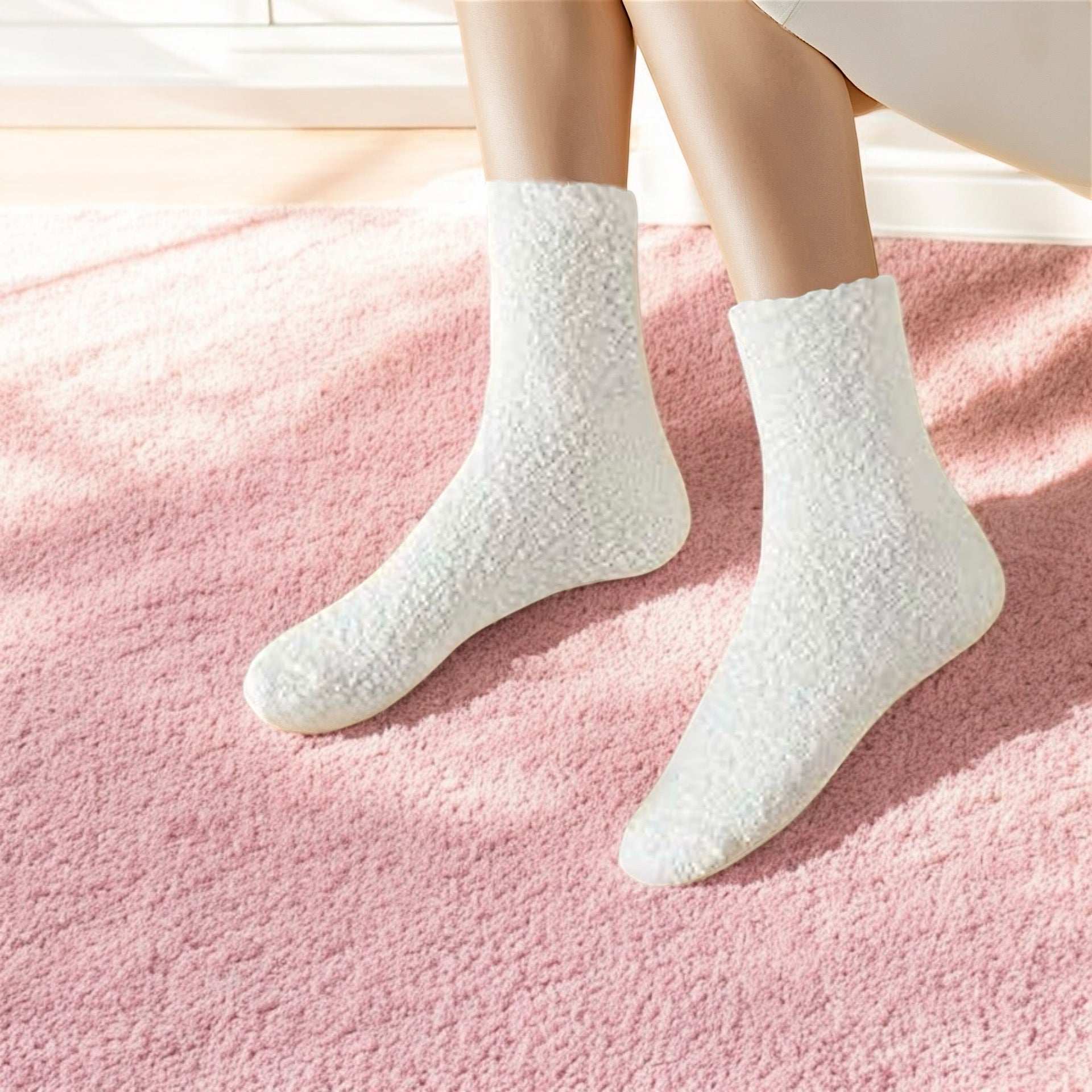 White cozy socks worn on feet on a pink carpet showcasing unique comfort socks present by Dabble Doll