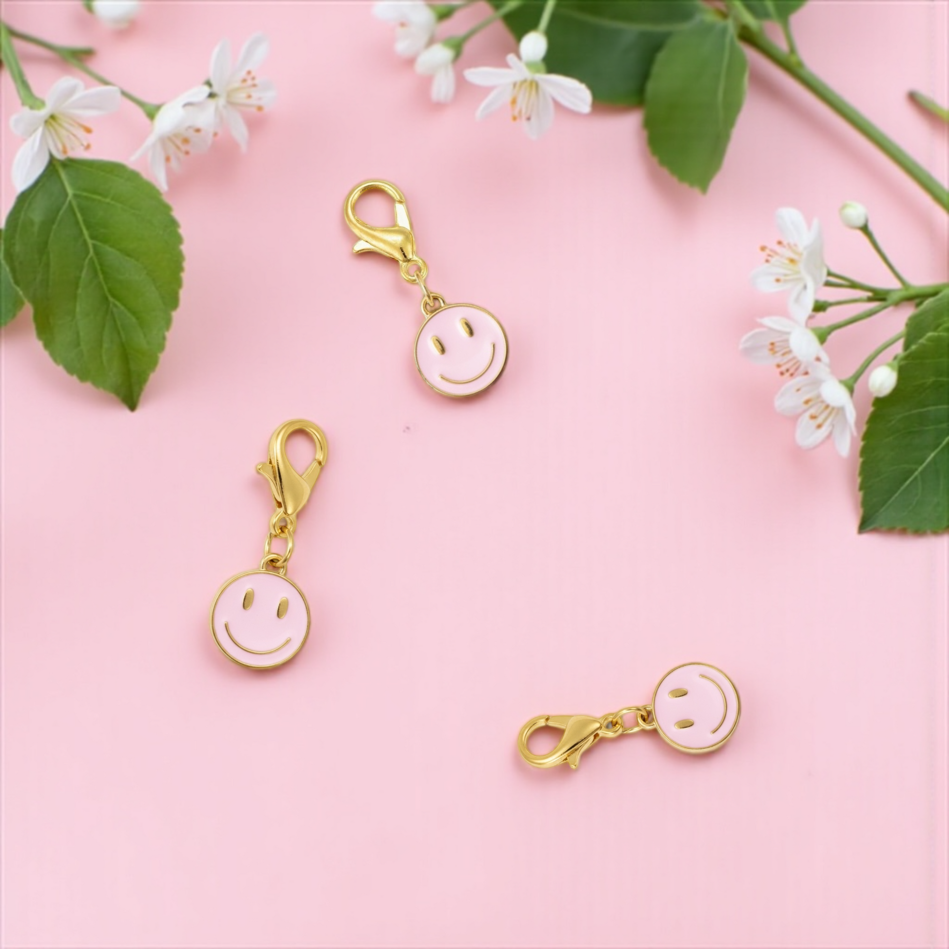 Dabble Doll zipper charm featuring a gold smiley face design, perfect for personalizing bags or accessories